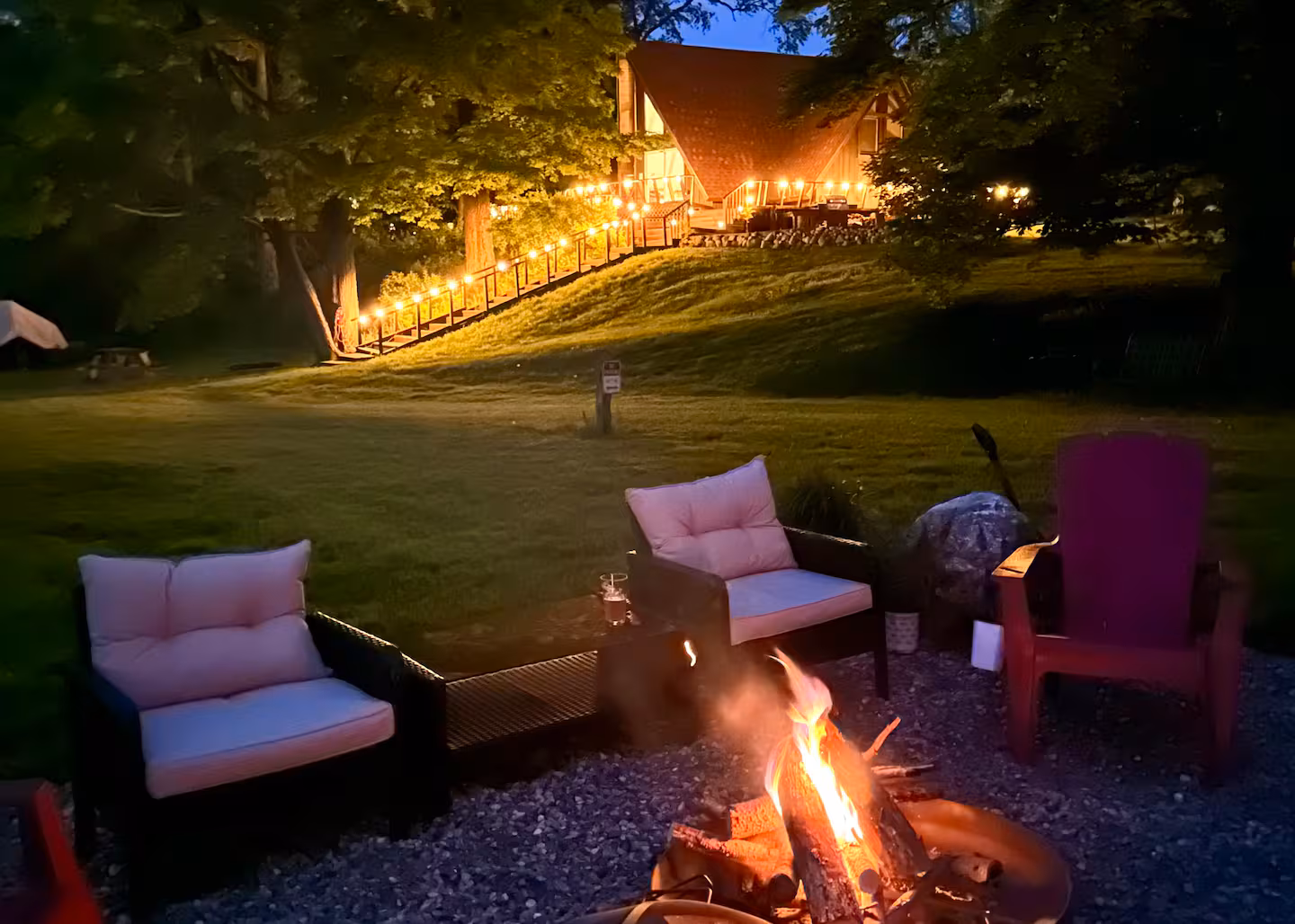 The A-Frame's lakeside fire pit at dusk