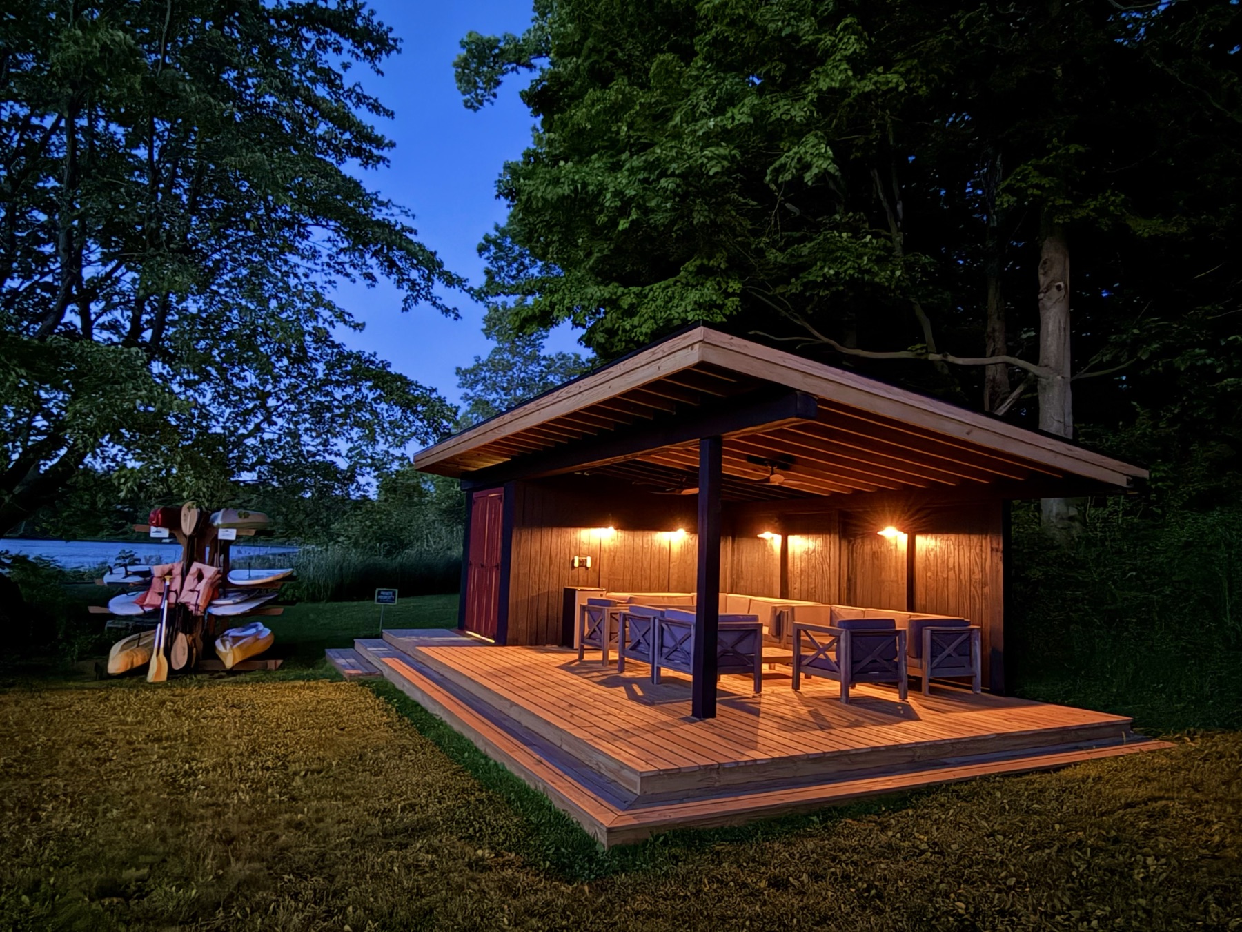 Waterfront pavilion lit up at twilight