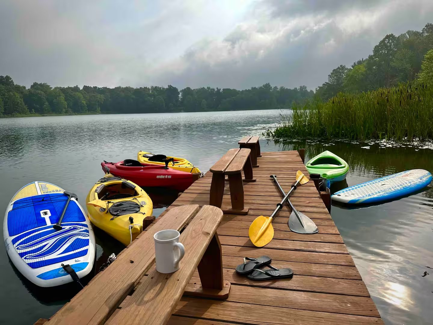 Kayaks and paddleboards on dock