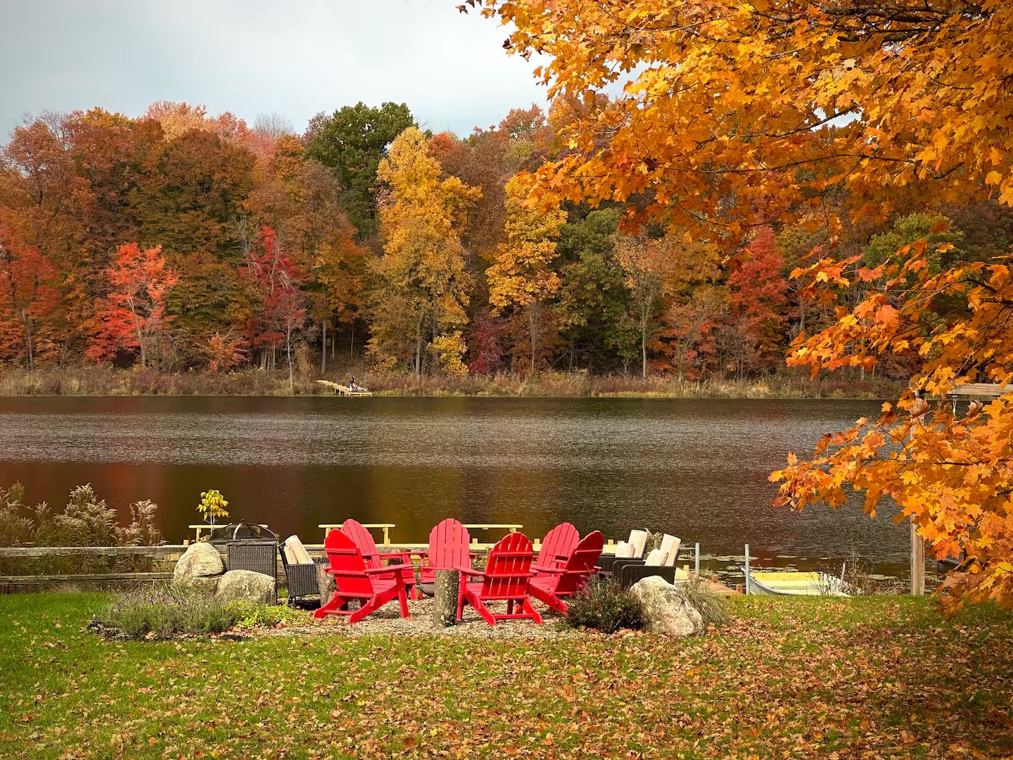 The lakeside fire pit crackling on a crisp autumn evening