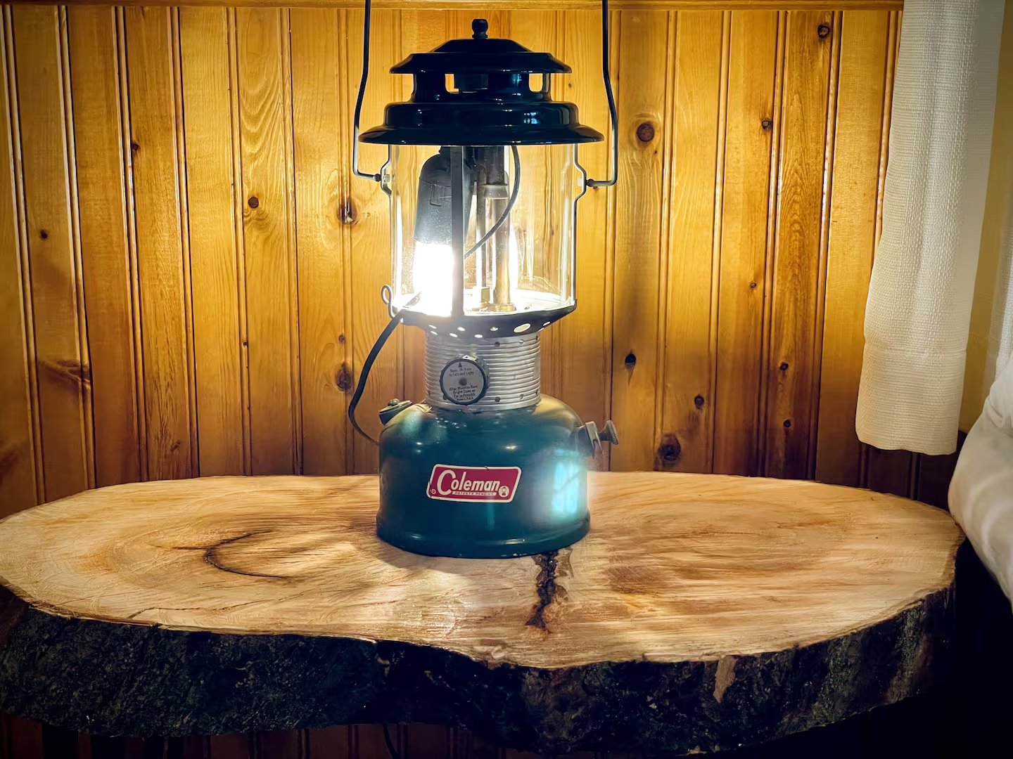 Vintage Coleman lantern on live edge table